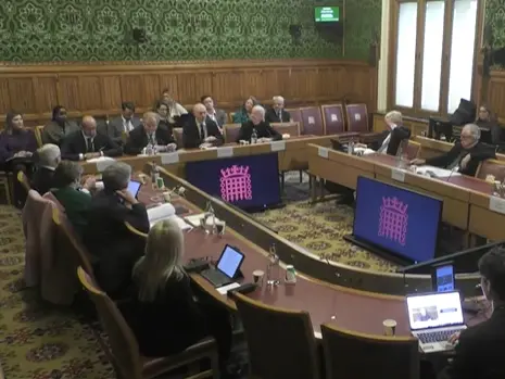 Executives from the Financial Times, DMG Media, News UK and Guardian Media Group are seen from a wide angle giving evidence at the Digital and Communications Committee at Parliament.